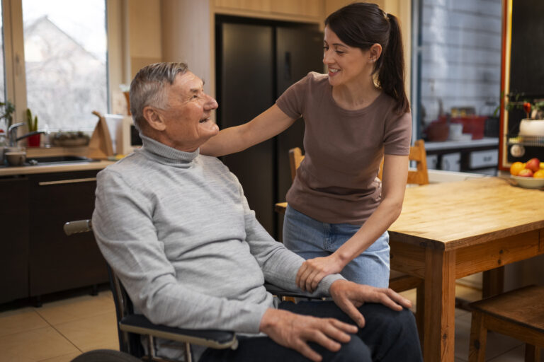 elderly-person-being-taken-care-by-female-caretaker